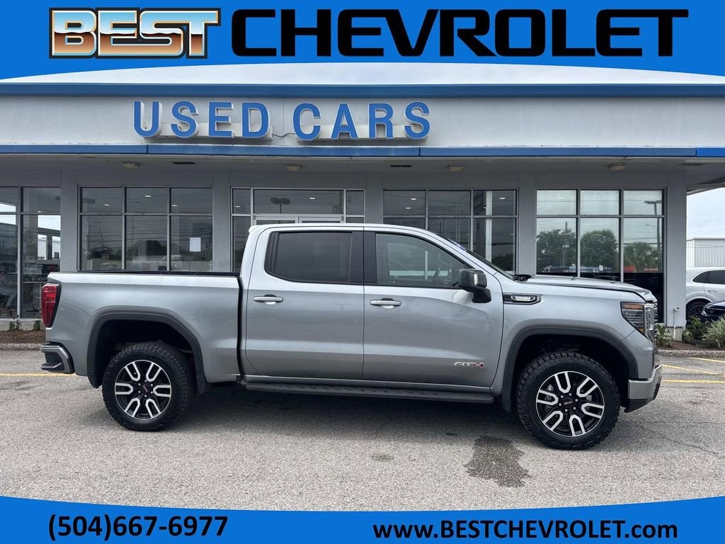 2024 GMC Sierra 1500 AT4 in Sterling Metallic — front three-quarter view